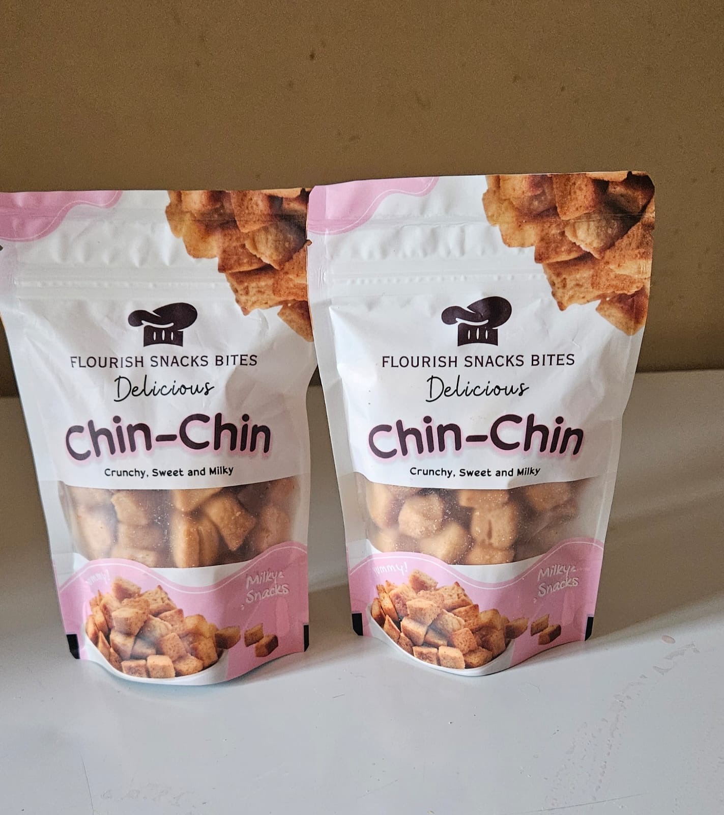 Two Chin-Chin pouches on a kitchen counter