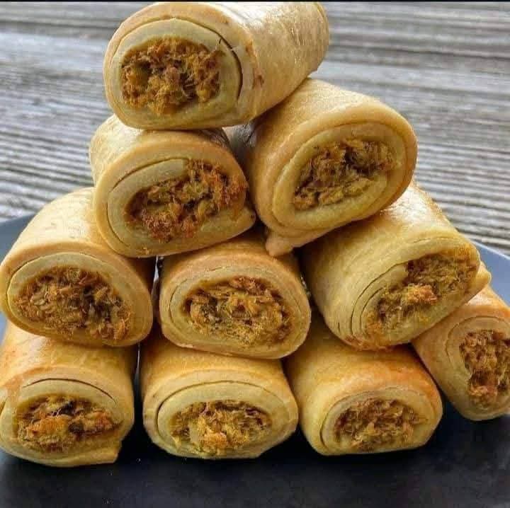 Homemade fish rolls stacked on a plate